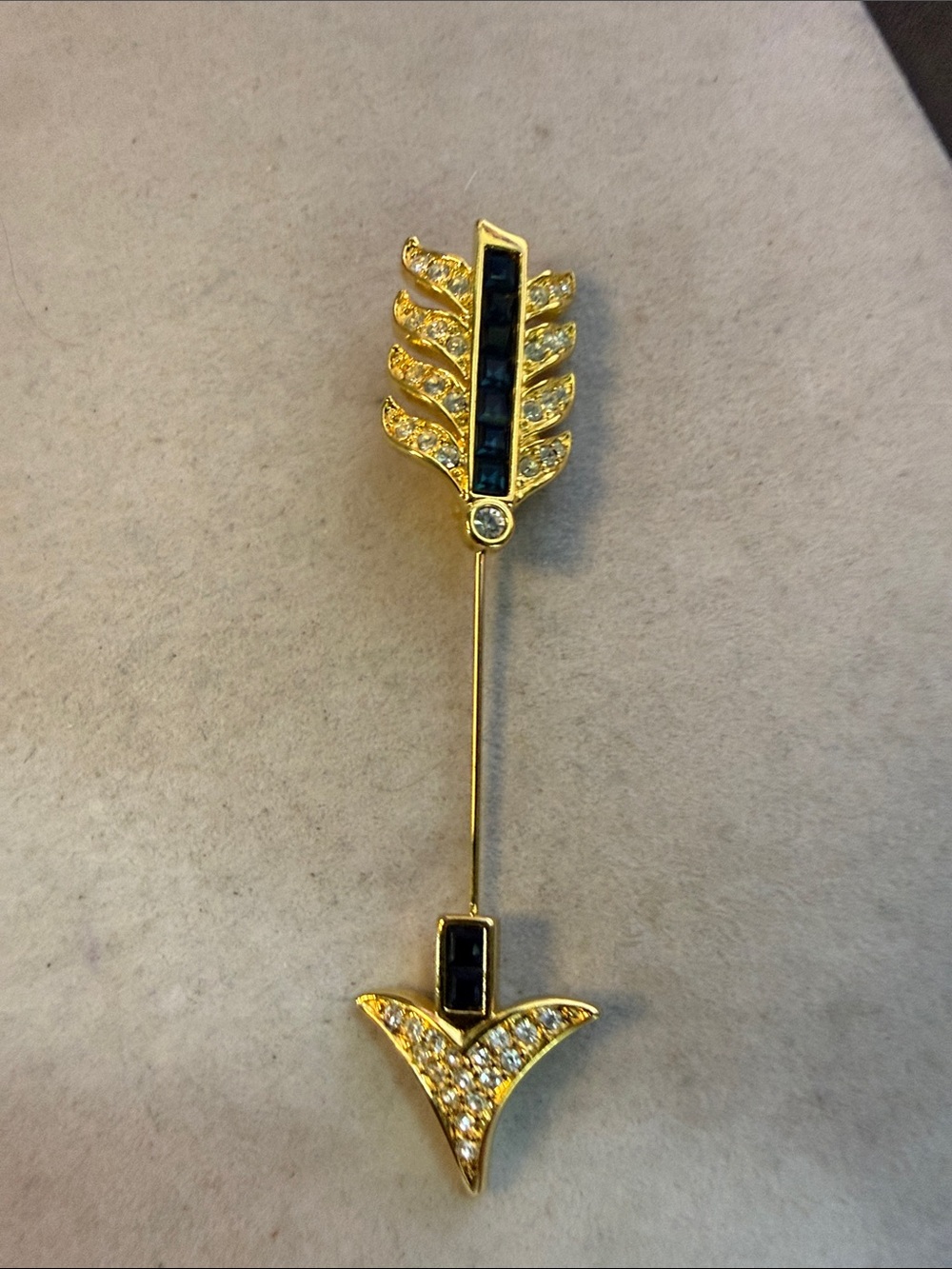 Nolan Miller Gold Arrow Brooch with Deep Blue Stones